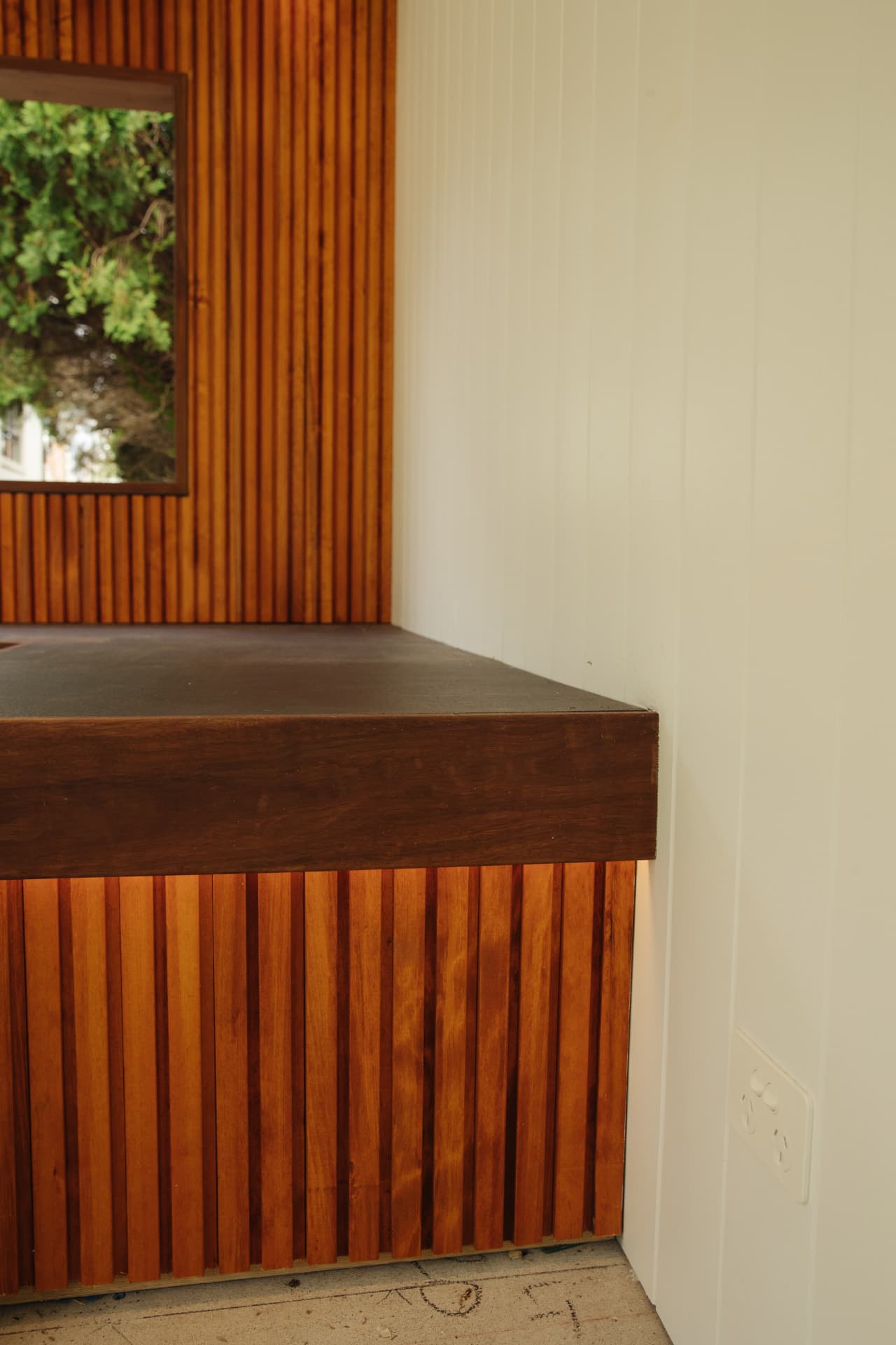 Hardwood batten bench end with a solid timber edge