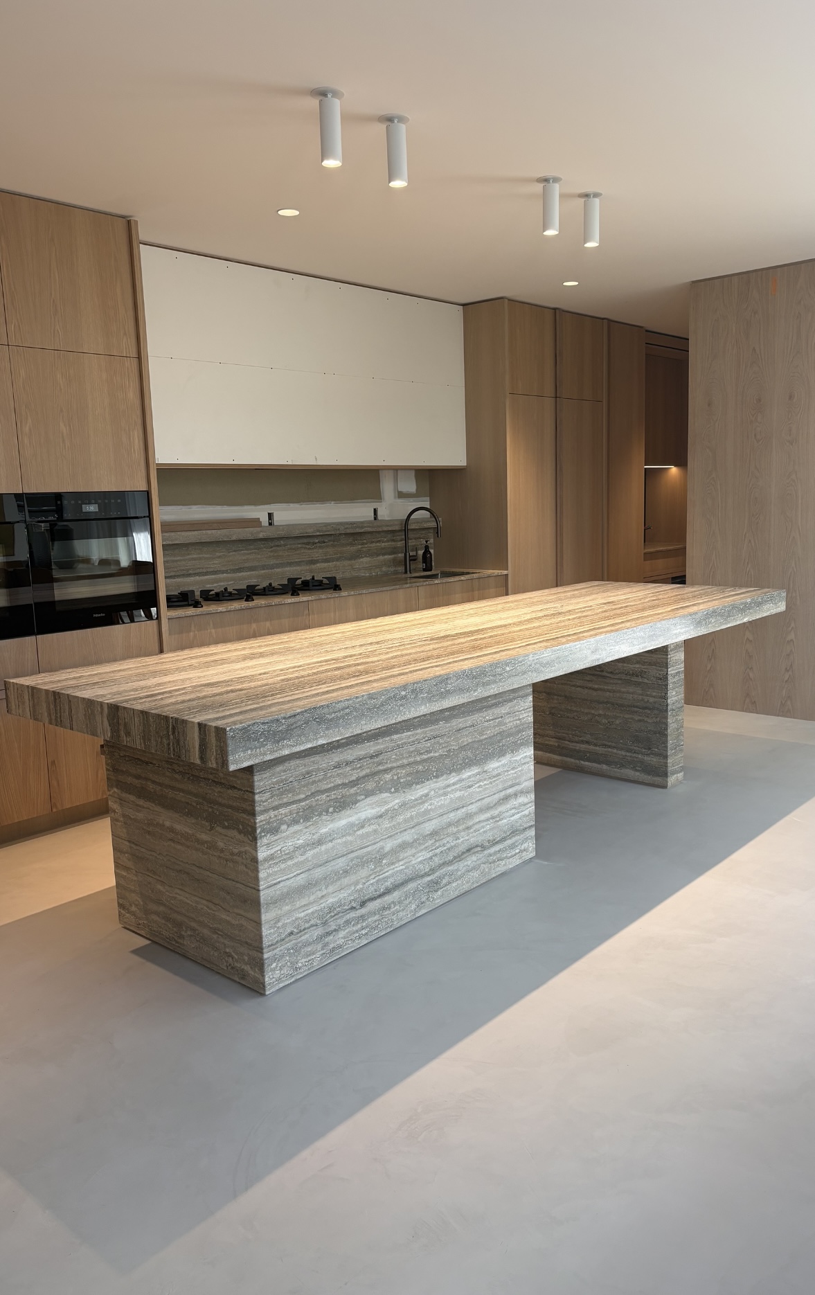 Andrew Place kitchen island in travertine and American oak